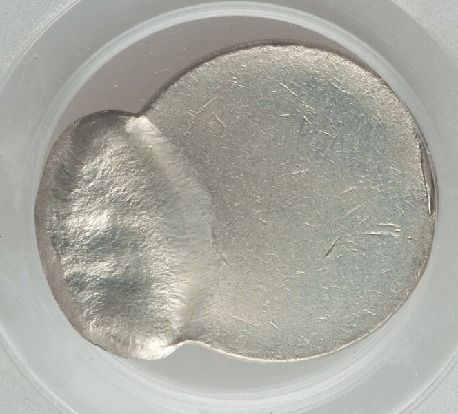 2002 Jefferson nickel off-center strike error showing design shifted to one side with visible blank planchet area and full date retained