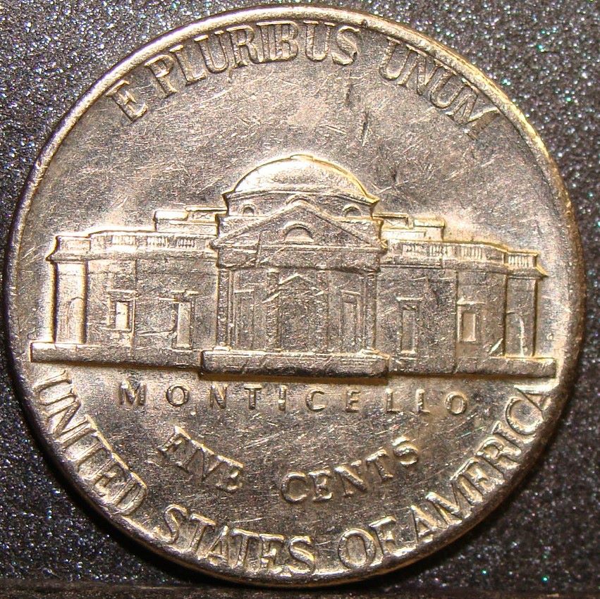 2002-P Jefferson nickel die clash error showing ghostly transferred design elements in the coin fields from obverse and reverse dies striking each other