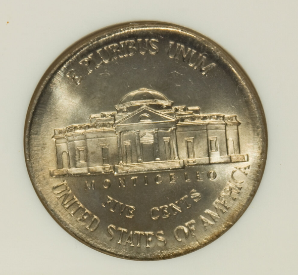 2002 Jefferson nickel broadstrike error showing design spread wider than normal with no retaining collar, resulting in thin rim and stretched proportions